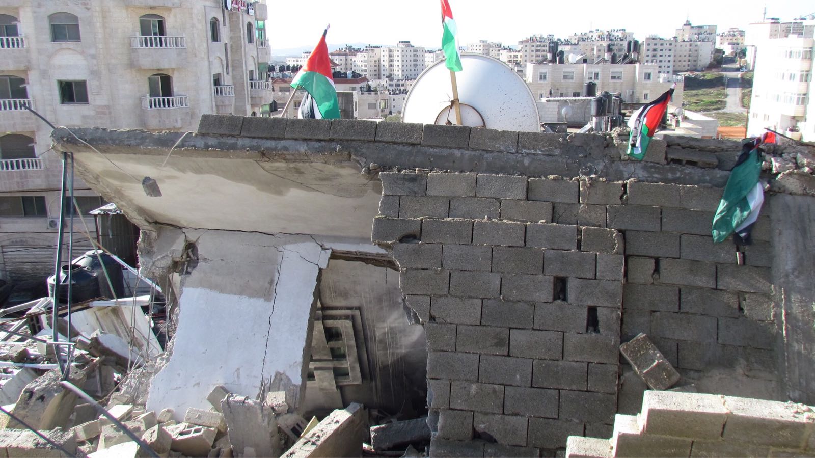 A four-story building blown up on punitive grounds in Al Am’ari refugee camp (Ramallah) on 15 December. Photo by OCHA