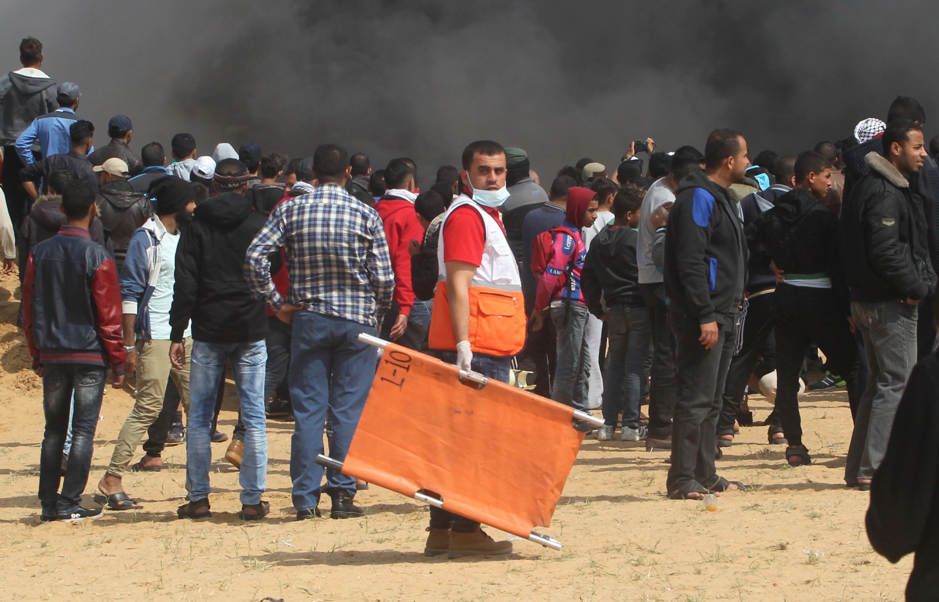 A member of the Palestine Red Crescent Society attends the Great March of Return demonstrations on 27 April 2018 to provide health support to those injured.