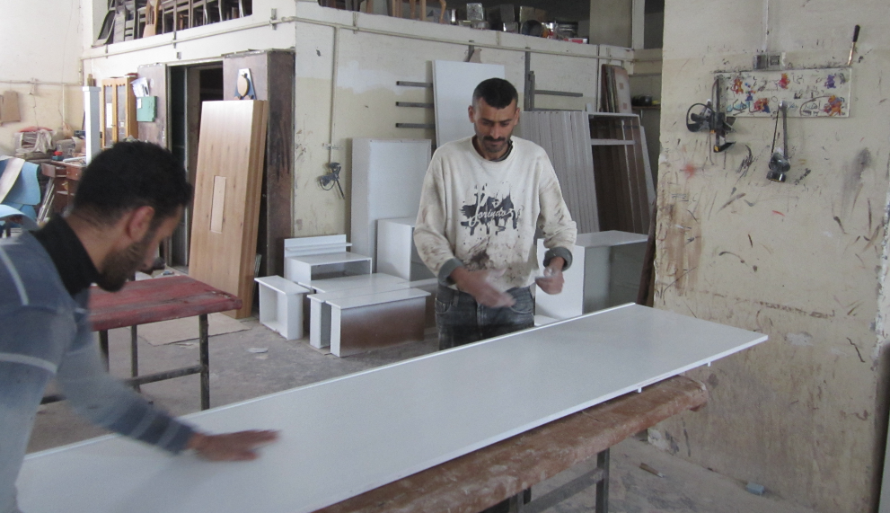 Workers in the Sousy Furniture Company. Photo by WFP/ElBaba