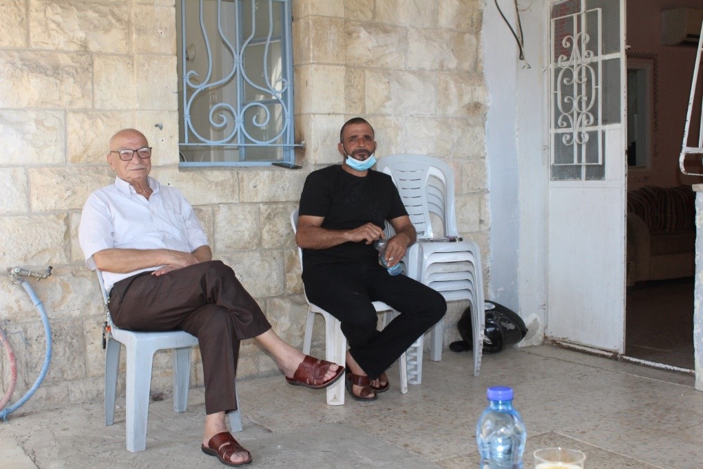 Mr. Salah with one of his sons, 13 October 2020. Photo by OCHA.