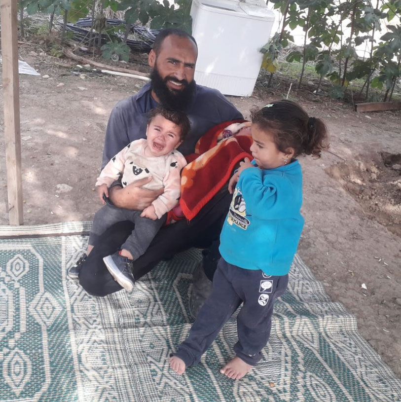 Radad Dagharme with his two toddler daughters and newborn baby, 7 December 2020. Photo by the affected family.