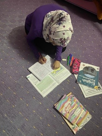 Rana successfully doing her home-work after receiving assistance.