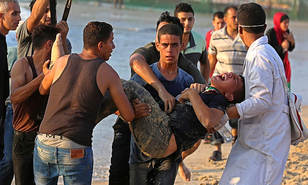 Palestinian injured during a demonstration protesting the naval blockade on the beach near the fence , northwest of Beit Lahiya. September 2018. Photo by Ashraf Amra