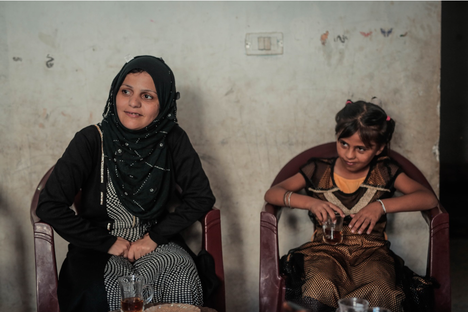 Eitidal, 30, and her daughter, Layan, 11, meet NRC staff at their home in Jabalia on 21 August 2019. ©  Photo by Ahmed Mashharawi, NRC