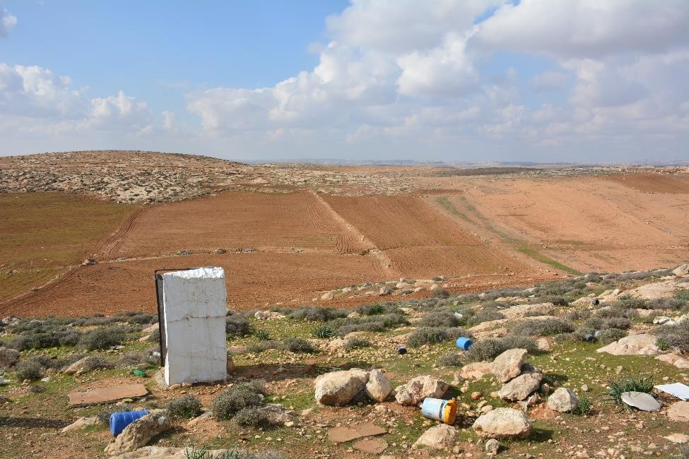 Rudimentary latrine with no water, only standing walls for privacy, located a few hundred metres from the nearest home in the Palestinian community of Khirbet ar Ratheem.