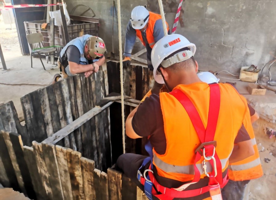 UNMAS team extracting a DBB from an excavation hole, November 2019. Photo by UNMAS