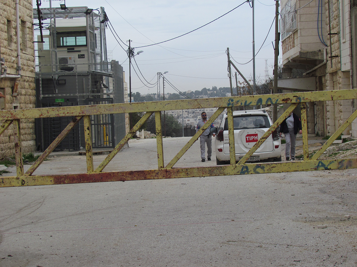 Temporary International Presence in Hebron (TIPH) at Israeli manned checkpoint (H2) Hebron. February 2018. © Photo by OCHA
