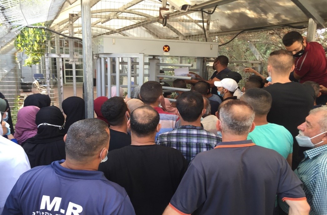 Farmers waiting at the entrance of Qalqiliya DCL to apply for ‘Seam Zone’ permits, 16 Sep 2020.