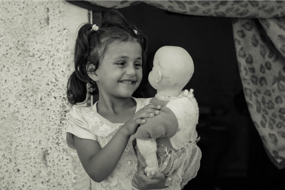 Rimas, 7, plays with her doll, at home in Jabalia on 21 August 2019. ©  Photo by Ahmed Mashharawi, NRC