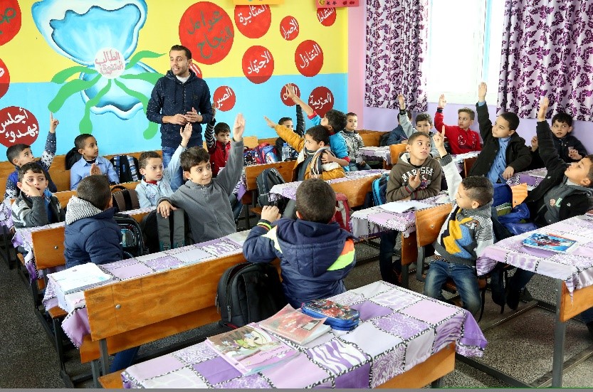 Students at Al Bahrain Elementary Boys School continue their lessons after UNMAS clearance, October 2019. Photo by Khalil Adwan.