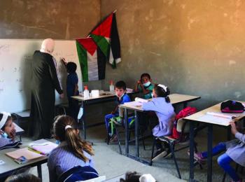 Arabic lesson in the Ras at Tin school, at risk of demolition. © Photo by OCHA