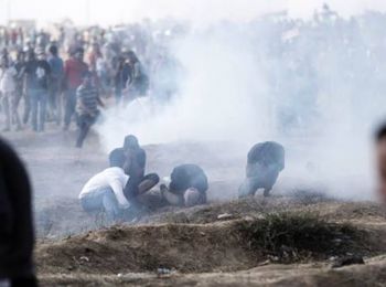 Demonstrators overcome by teargas at the Gaza fence, March 2019.