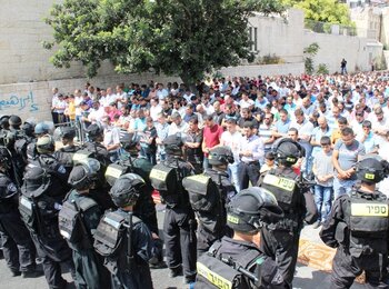 Friday prayer in a street of Wadi Al Joz (East Jerusalem) due to the age restrictions on access to the Al Aqsa Mosque, 26 September 2014. Photo by Maisa Abu Ghazaleh