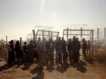 Farmers waiting to access their olive groves behind the Barrier, next to Beit Surik village (Ramallah), 31 October, 2019. ©  Photo by OCHA