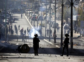 Clashes between Palestinians and Israeli forces during a protest against the US recognition of Jerusalem as Israel’s capital, Bethlehem,12 December 2017. 