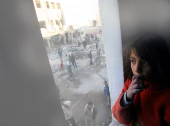 Girl looking at destruction site after Gaza 2008-2009 conflict, February 2009. © Photo by UNICEF