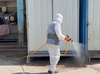 Spraying pesticides at an UNRWA school used as a shelter for displaced people in Gaza, May 2026. Photo by OCHA