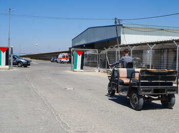 A Toktok is waiting to support old people to move from Erez point to 5-5