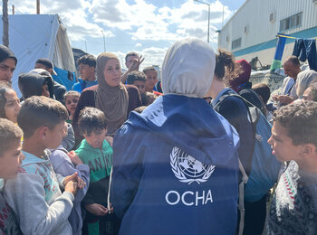 People in UNRWA’s logistics base in Rafah. Photo by OCHA 