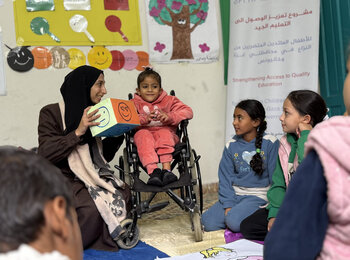 Six-year-old Dana (seated on a wheelchair) at the project centre where she receives education and psychosocial support. Photo by PSCF, 11 December 2025.