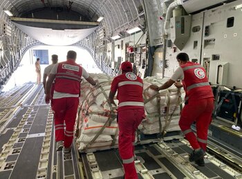 A logistics team from the Egyptian Red Crescent Society in Al Arish airport, Egypt, organizing and preparing humanitarian aid for transport into Gaza. Photo by the Egyptian Red Crescent Society