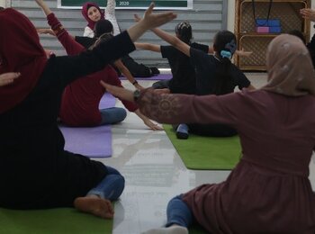 Women attending a yoga session at AISHA, 2020. Photo by AISHA.