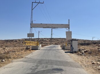 An iron gate near the Palestinian village of Al Buweib, in Hebron governorate, one of 27 closures installed by Israeli forces in the first half of September across the West Bank, risking further disruption of access to services, workplaces and key road arteries. Photo by OCHA 
