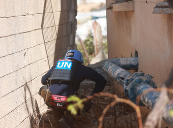 A Mine Action specialist inspects a water well compound in Khan Younis for potential explosive hazards following the ceasefire, in support of humanitarian and recovery efforts, 19 October 2025. Photo by UNMAS 