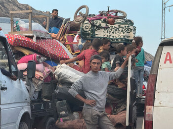 Palestinians displaced from Gaza city wait in heavy traffic on Al Rashid Road leading south. Photo by OCHA/Olga Cherevko