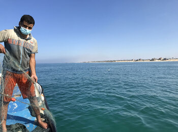 Shadi Qanan on his repaired boat.