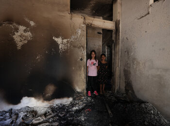 Girls in a damaged house in the Jenin Refugee Camp. Photo by UNICEF, 5 July 2023