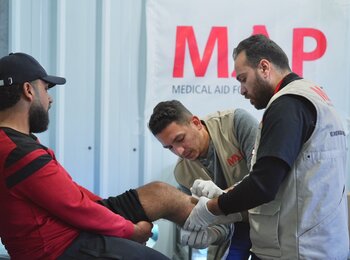 Ibrahim with a Medical Aid for Palestinians team. Photo by Palm Media for Medical Aid for Palestinians 