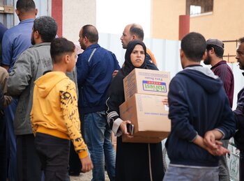 People queueing for food assistance. Across Gaza, most areas are off limits or unsafe for humanitarian organizations to reach and provide critical assistance. A recent survey has found that one in every three respondent families is experiencing severe hunger. Photo by the World Food Programme, 8 December 2023