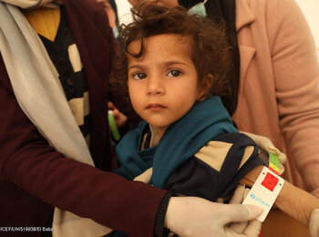 Screening for malnutrition in Gaza using arm measurement. Photo by UNICEF/El Baba, February 2024.