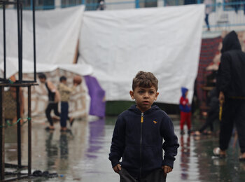 A 6-year-old displaced boy in southern Gaza, where heavy rains have worsened the already dreadful living conditions of people staying outdoors, adding to the risk of waterborne diseases. Photo by UNICEF/El-Baba, 6 December 2023