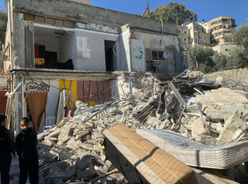A two-storey residential building demolished by its Palestinian owners due to the lack of an Israeli-issued building permit, in Silwan, East Jerusalem. Six households, comprising 39 people were displaced. 5 January 2025.Photo: OCHA.