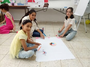 Sara engaging with her peers during a Social and Emotional Learning (SEL) and Psychosocial Support (PSS) session held in the summer of 2025. The session focused on helping children recognize, express and manage their emotions, supporting their emotional well-being and resilience.