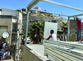 A Palestinian family forced to demolish their home in Ras Al ‘Amud, East Jerusalem. Photo by OCHA, 24 August 2022.