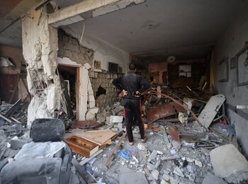 Jamal inspects his home in Khan Younis, in the southern Gaza Strip, after it was heavily damaged in hostilities. By 6 November, over 40,000 housing units across the Gaza Strip had been destroyed, according to the Ministry of Public Works and Housing. Photo by ©UNICEF/Zaqout, 16 November 2023