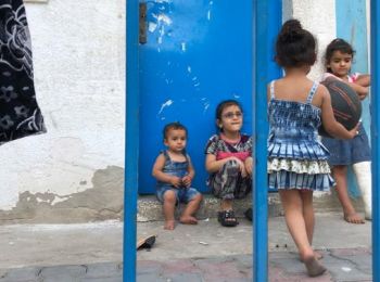 An internally displaced Palestinian family staying in and UNRWA-run school in Gaza, 14 April 2021. Photo by OCHA 