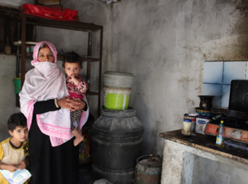 Mona and two of her seven children, in a poor household affected by electricity and water shortages. Rafah, Gaza Strip, October 2017. © Photo by OXFAM