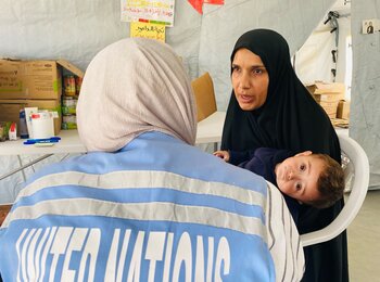 Palestinian mother and child receiving nutrition support in Gaza through funding from the occupied Palestinian territory Humanitarian Fund. Photo: OCHA