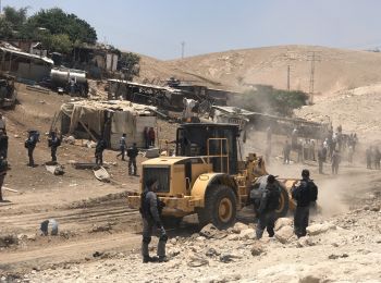 Israeli forces leveling land next to Khan Al Ahmar, in preparation for the demolition of the community, 4 July 2018. © Photo by JFF