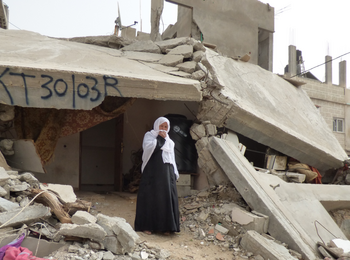 Woman living in debris of her destroyed house in east Khan Younis. February 2015. Photo by OCHA