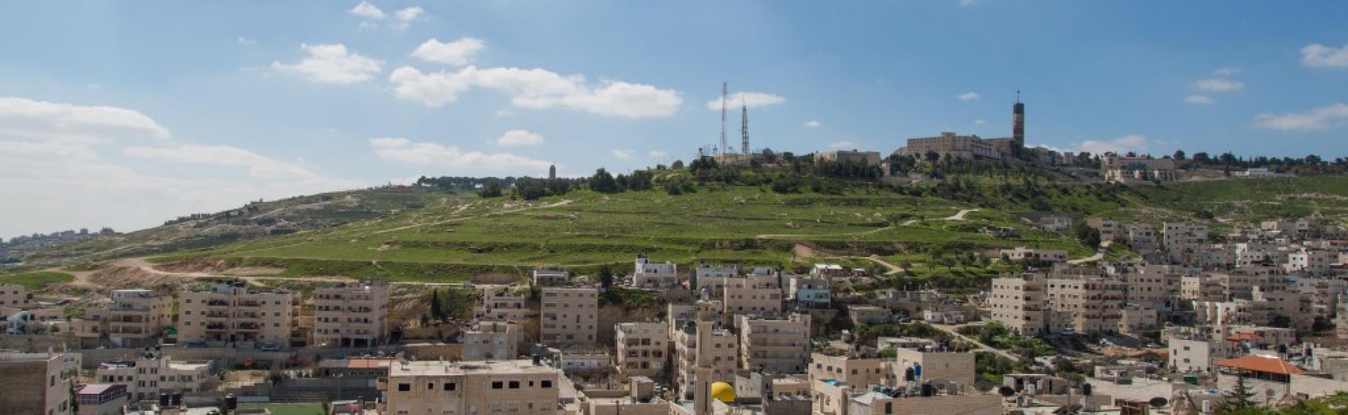 ‘Issawiya, East Jerusalem (foreground), occupied West Bank and Hebrew University (background), 2013. ©  Photo by OCHA