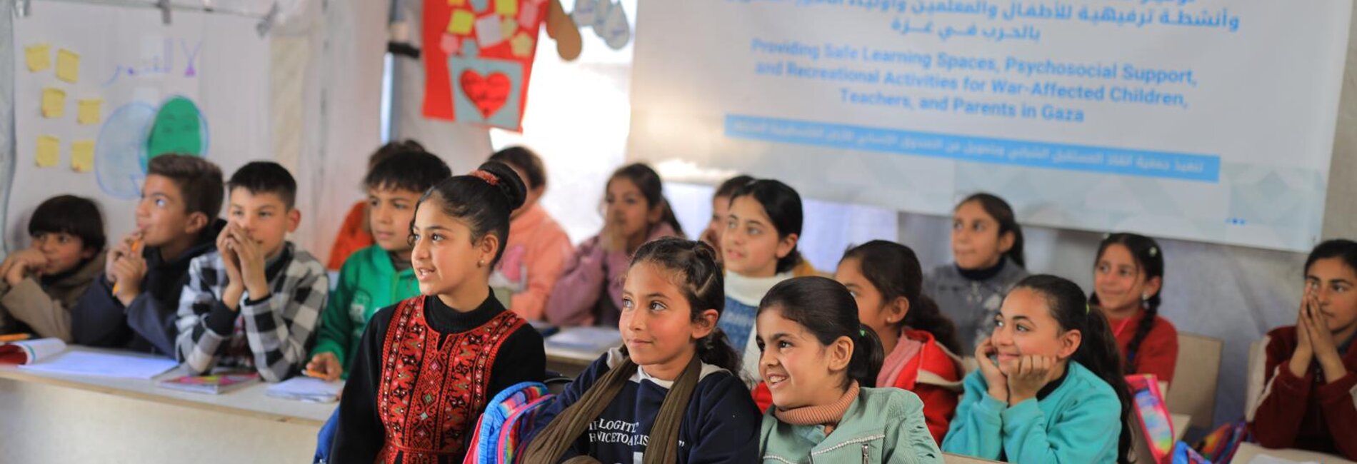 Children in Gaza City attend classes in temporary learning spaces providing non-formal education and psychosocial support. Credit: ©SYFS, Gaza City, 2026