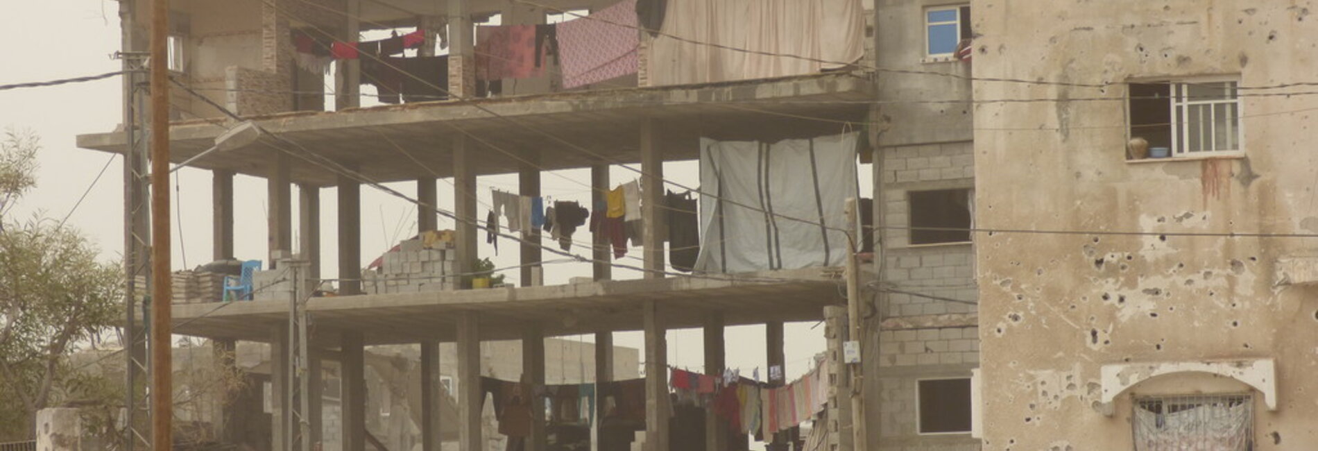 מבנה בשיקום שבו מתגוררים עקורים פנימיים, בית חנון / צילום: משרד האו״ם לתיאום עניינים הומניטריים, אוקטובר 2015.