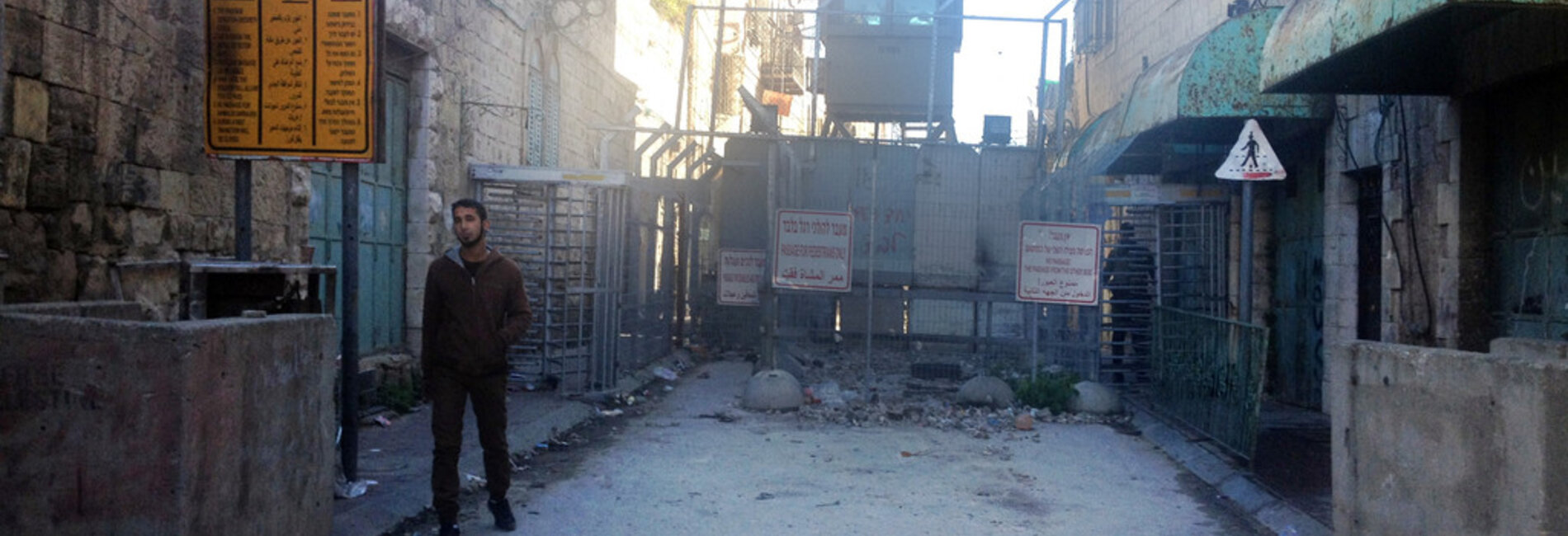 Checkpoint controlling access to the Ash Shuhada street in the heart of Hebron city. Photo by OCHA