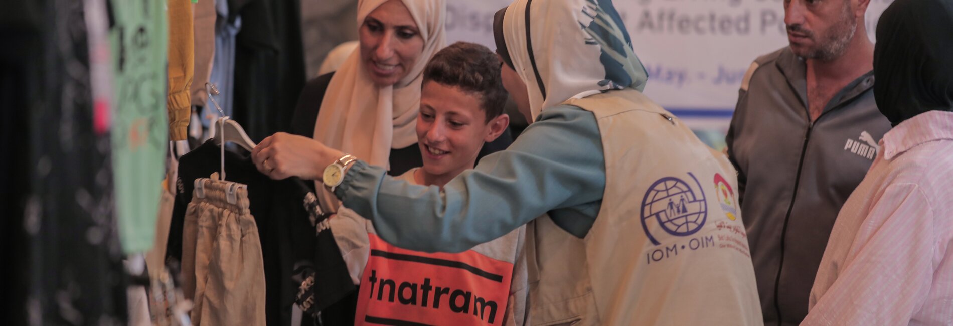 A child in Gaza getting new clothes with vouchers provided by the Beit Lahia Development Association (BLDA) and the International Migration Organization (IOM) through funding from the Central Emergency Response Fund (CERF). Photo by BLDA 