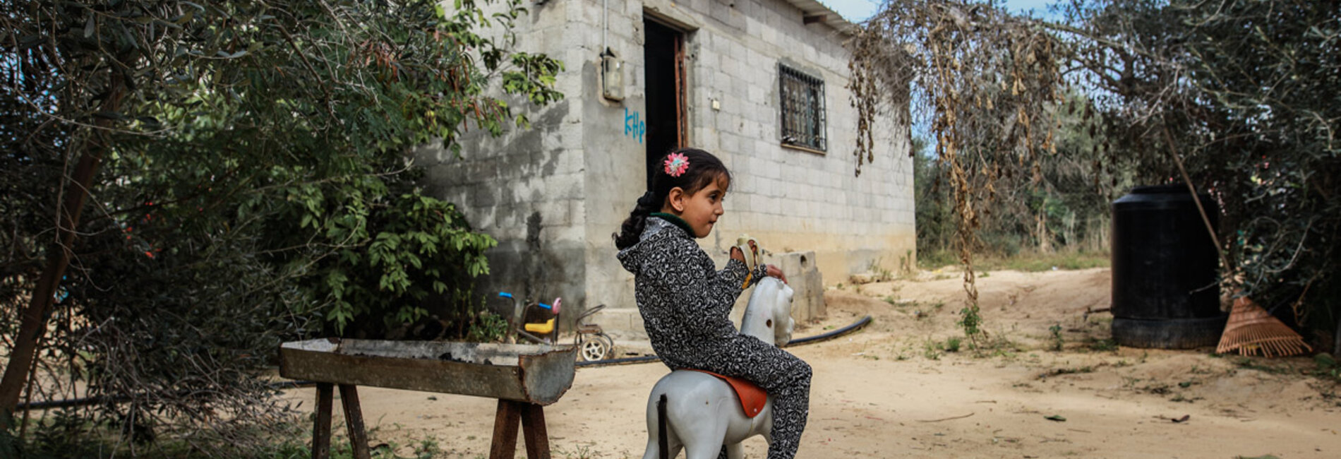 Four-year-old Leen Abu Hajras playing in front of her home in Khan Younis, the Gaza Strip, following her recovery from malnutrition. Photo by Mohammed Al Reefi for the Catholic Relief Services.